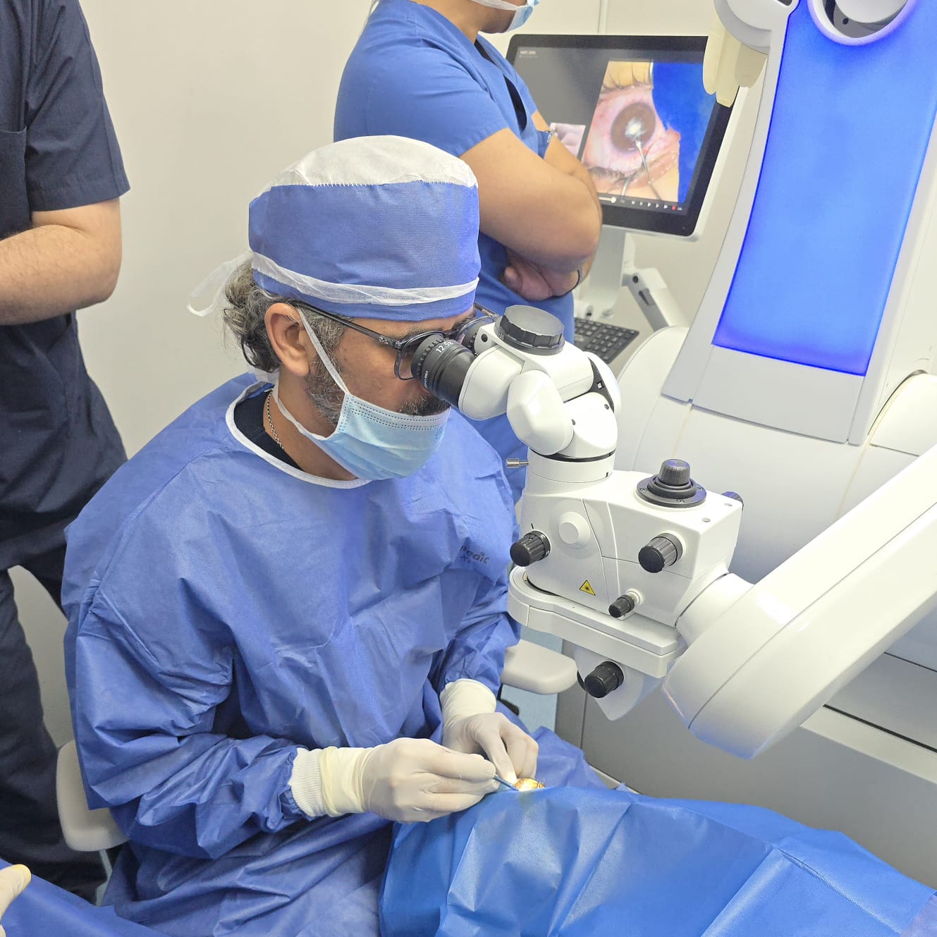 Dr. Ahmed Garsh performing eye microsurgery